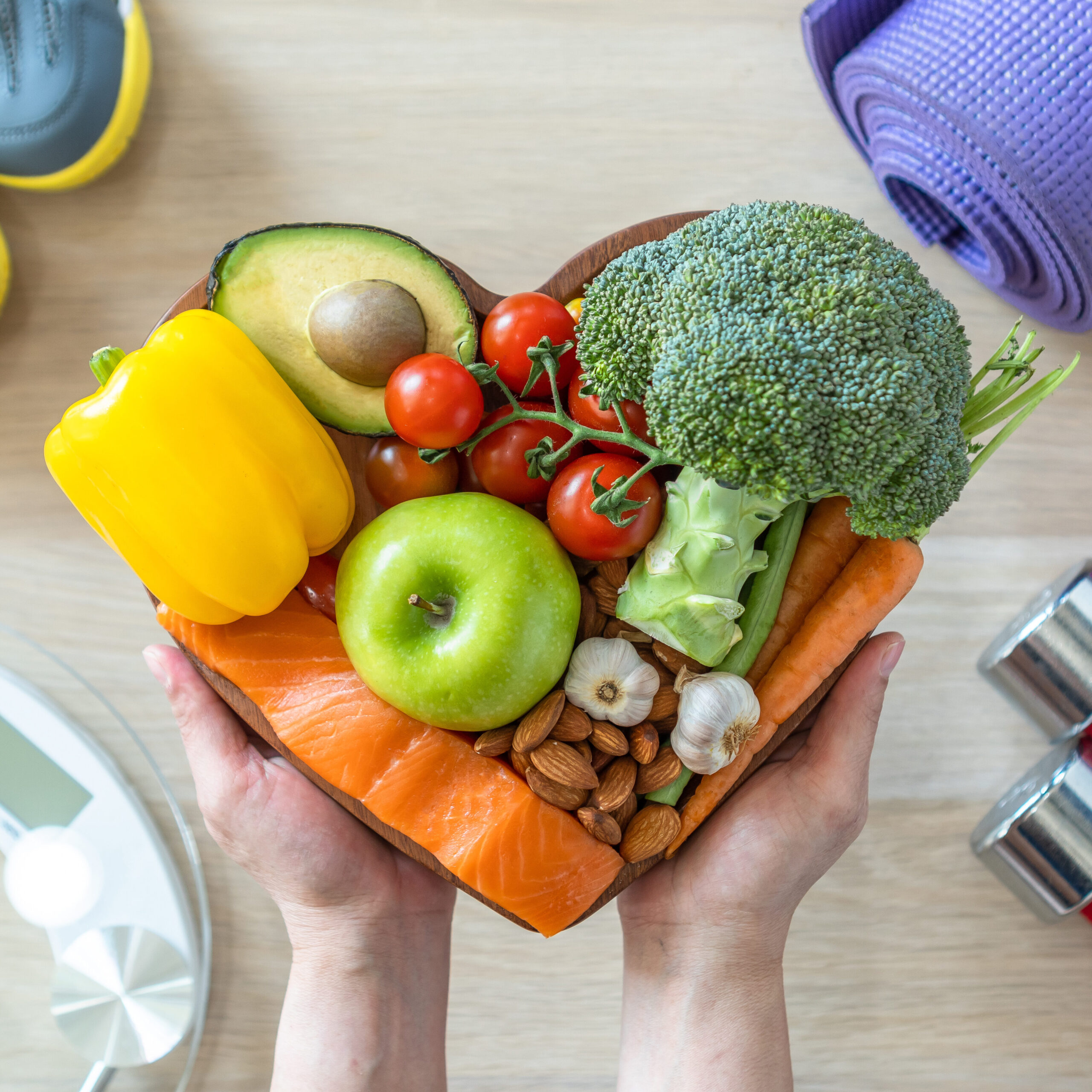 Colorful display of fruits and vegetables and exercise equipment.