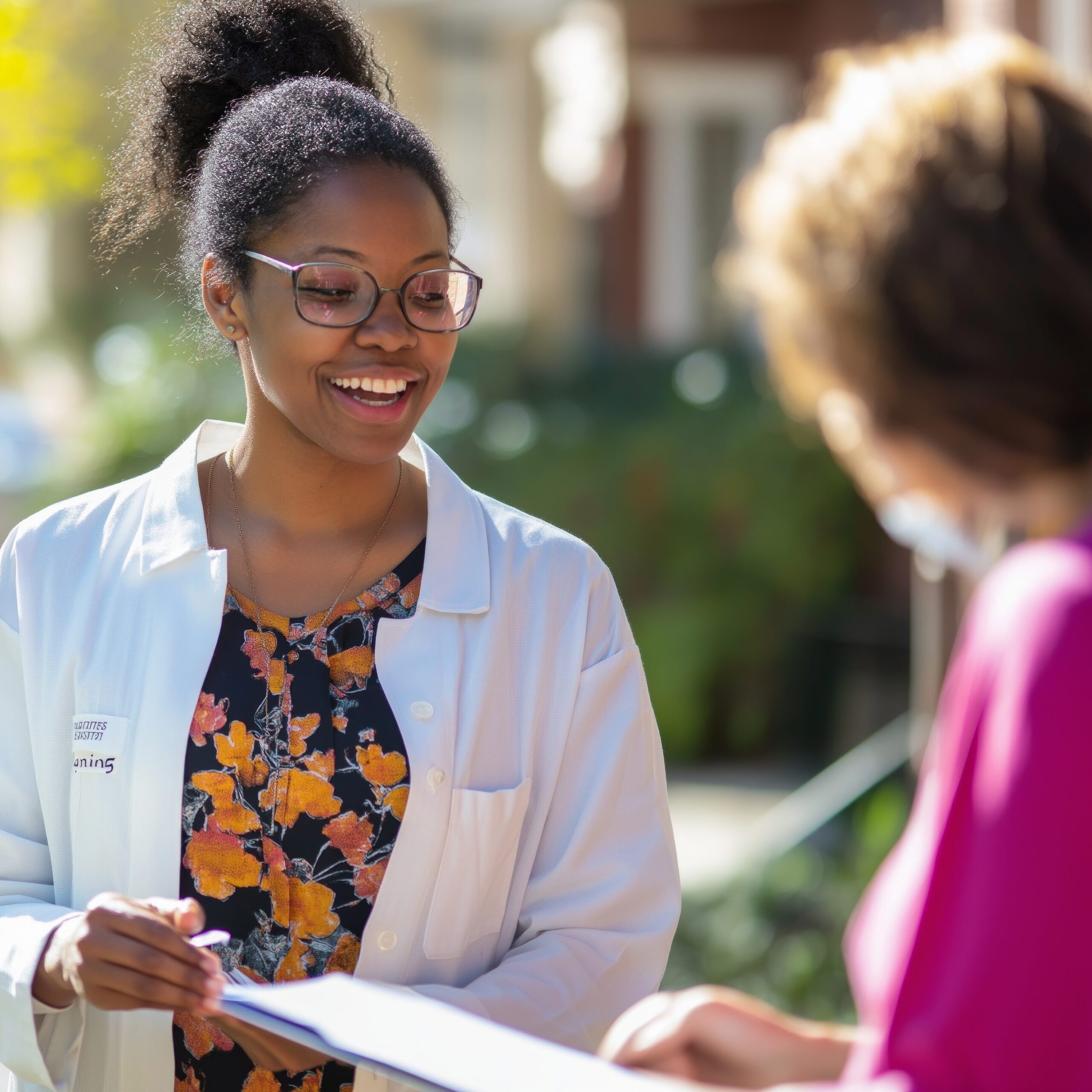 Clinician talking with two people